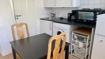 Apartment, Multiple Beds | Private kitchen | Fridge, microwave, stovetop, electric kettle