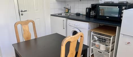 Apartment, Multiple Beds | Private kitchen | Fridge, microwave, stovetop, electric kettle