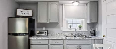 Fridge, microwave, coffee/tea maker, toaster