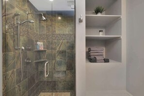 Shower, hair dryer, towels, shampoo