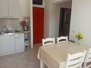 Fridge, stovetop, cookware/dishes/utensils