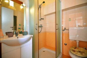 Shower, hair dryer, towels, toilet paper