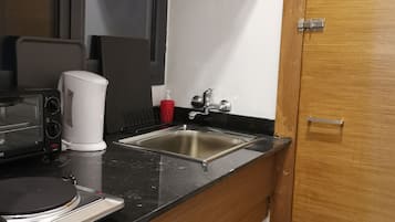 Estúdio standard | Frigobar, fogão, cooktop, cafeteira/chaleira