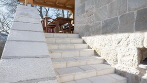 A staircase with stone steps leading up to a wooden deck area. - Nice home in Obrovac Sinjski with WiFi (Obrovac Sinjski)