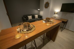 Premium Loft, 1 Bedroom | Living area | 40-inch Smart TV with digital channels, TV, heated floors