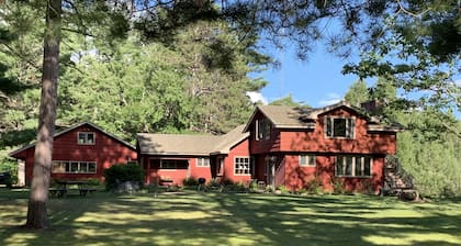 Family friendly lakefront property on large wilderness estate with sandy beach