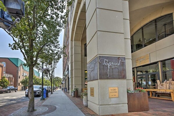 A building with a sign for 'Taproof' and a plaque indicating 'RADIO CENTER est. 2001'.