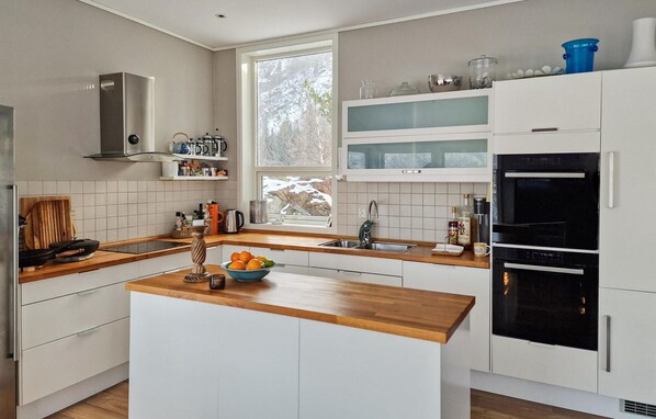 Fridge, dishwasher, coffee/tea maker, cookware/dishes/utensils