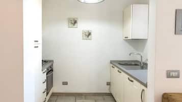 Fridge, oven, dishwasher, dining tables