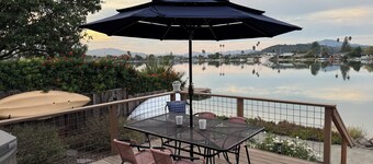 WATCH THE SETTING SUN &<br>THE MARIN MOUNTAINS OR KAYAK THE <br>LAGOON from the dock