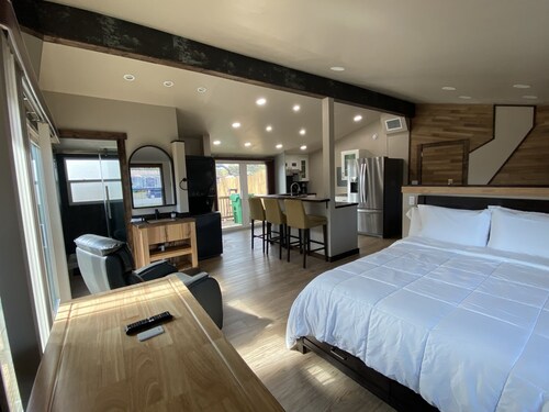 Modern Ranch Studio With a Beautiful Round Porch