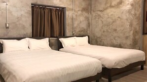 A double bed with a headboard, a power outlet, and a curtain on the wall. - Villa Gazamani (Yaese)