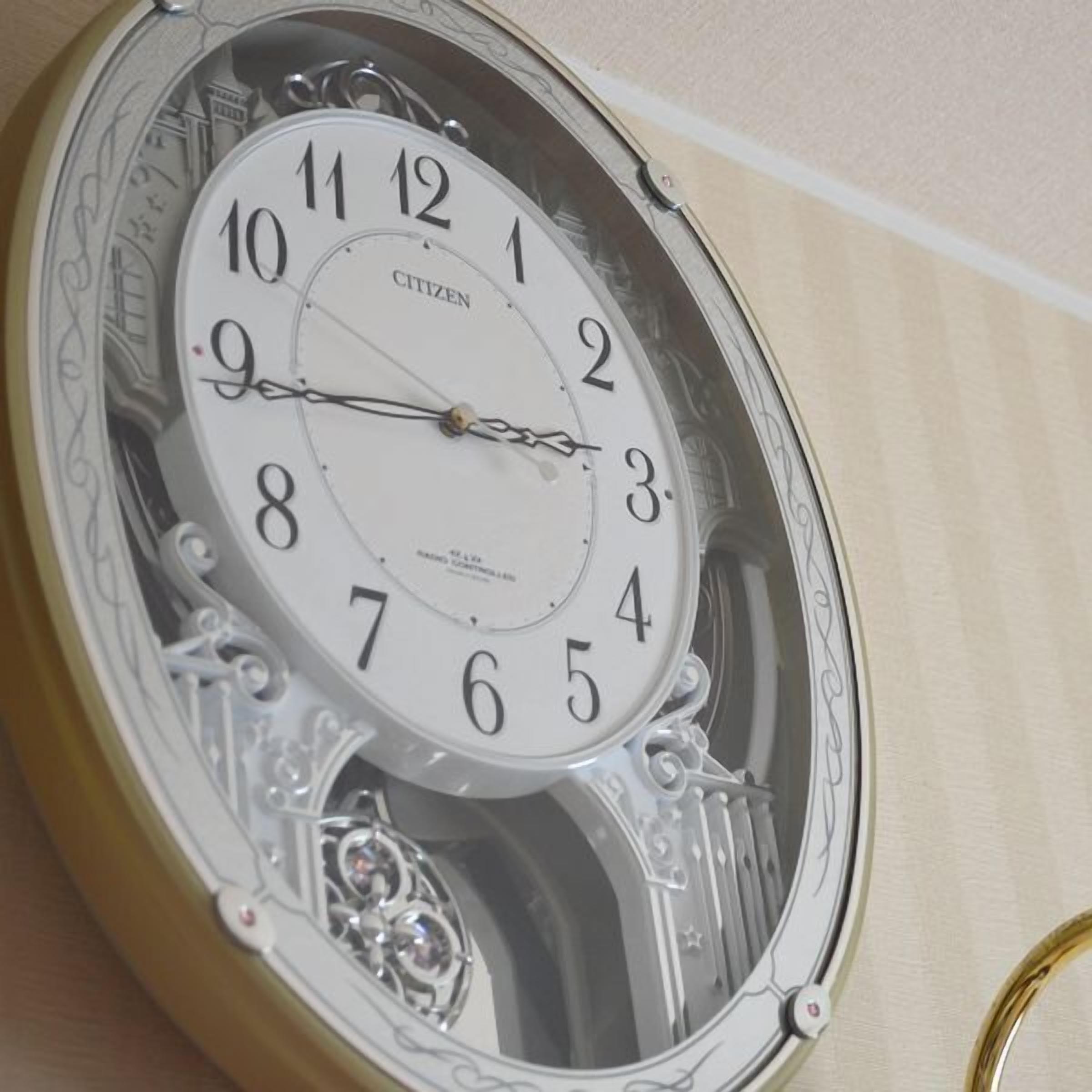 A detailed clock with ornate designs and the brand 'CITIZEN' visible.