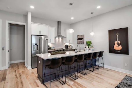 Fridge, microwave, oven, stovetop. Modern Nashville Retreat • Rooftop Hot Tub + Views