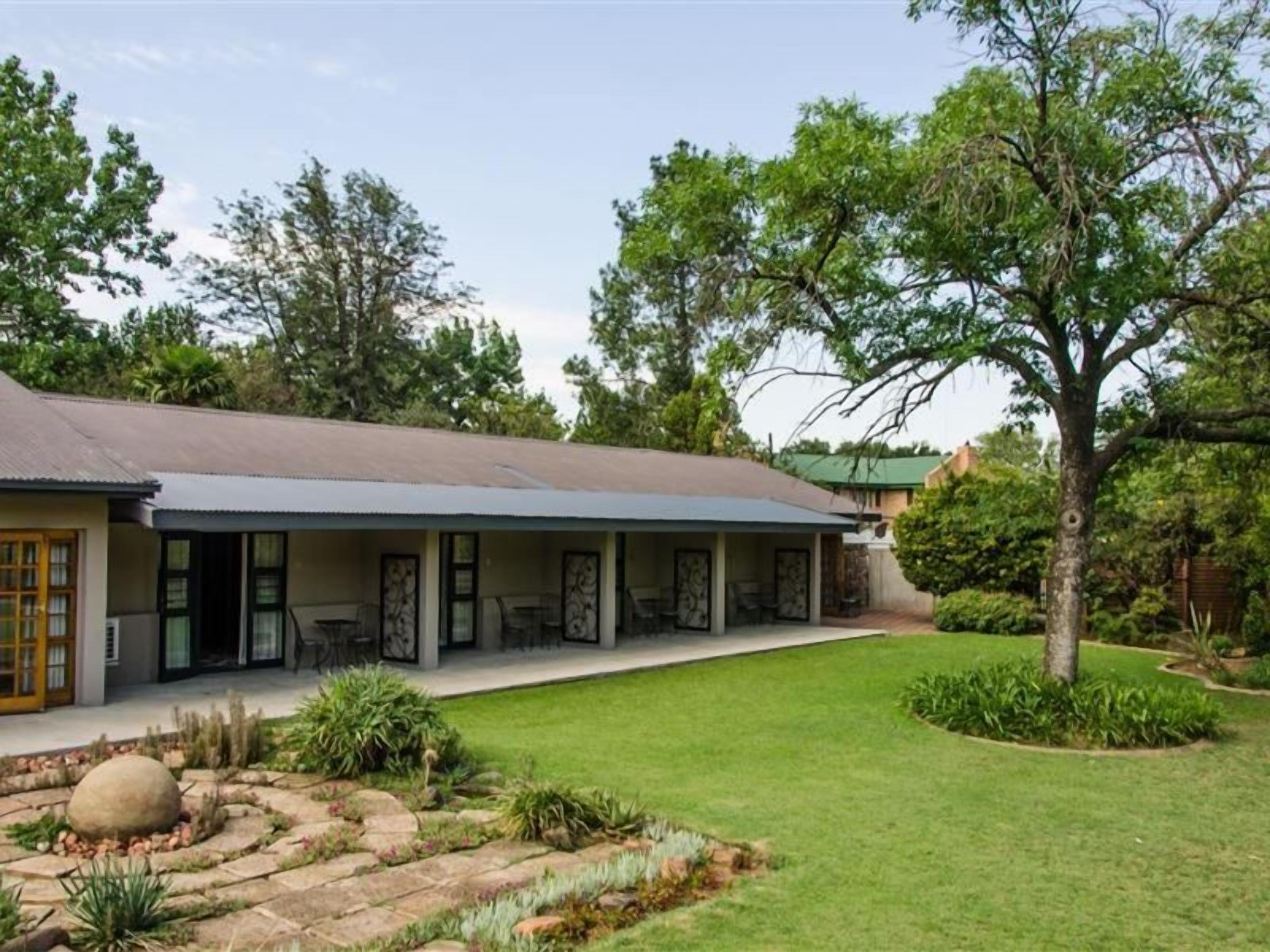 A two-story house with a covered patio area.