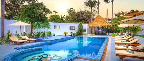 Outdoor pool, open 7:00 AM to 7:00 PM, pool umbrellas, pool loungers