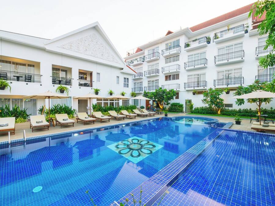 Outdoor pool, open 7:00 AM to 7:00 PM, pool umbrellas, pool loungers