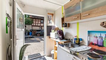Fridge, microwave, stovetop, coffee/tea maker