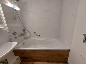 Bathtub, hair dryer, towels