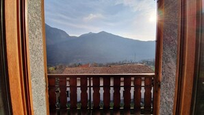 A balcony with a view of mountains.