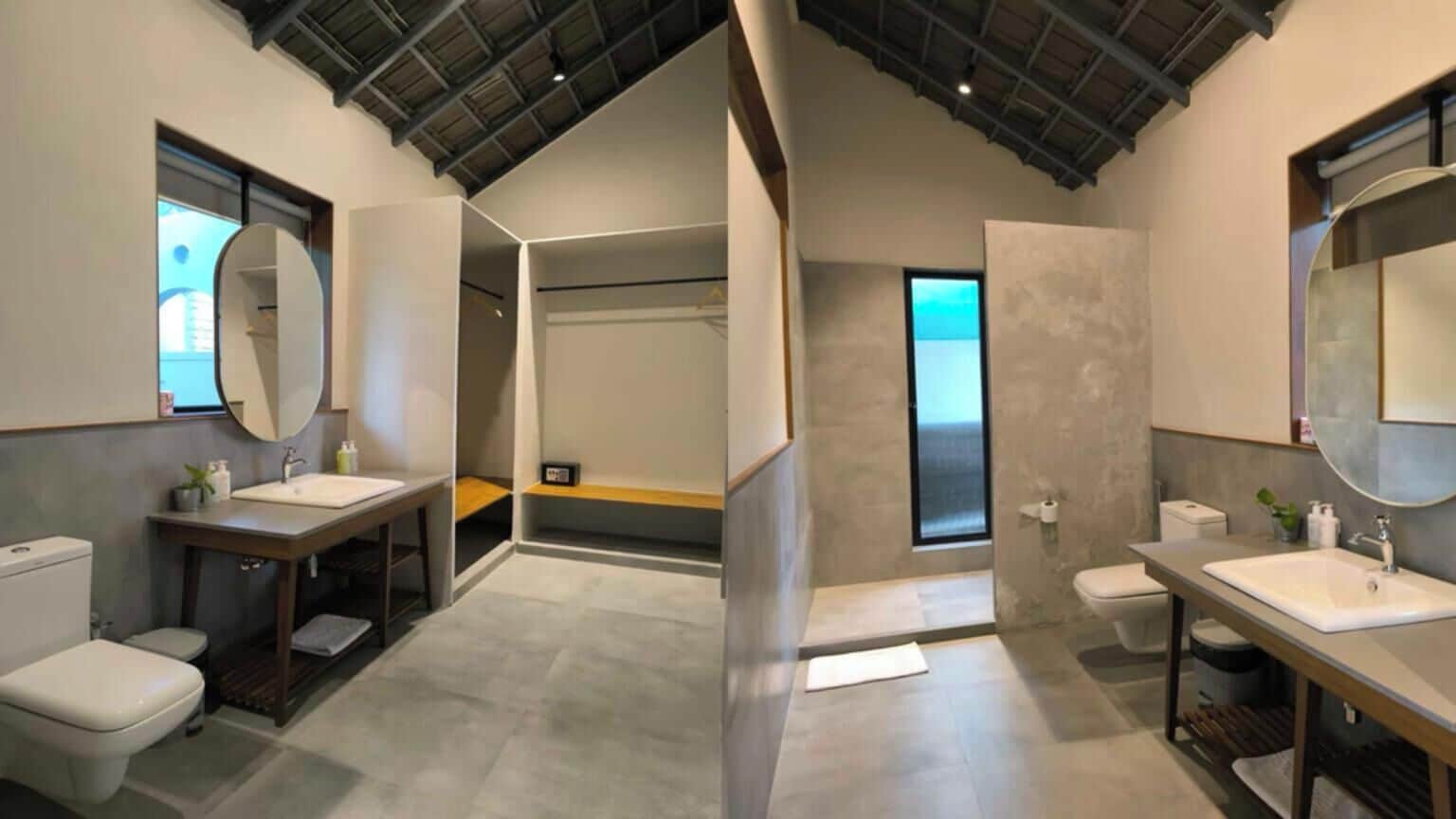 A modern bathroom with two sinks, a shower, and a toilet.