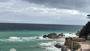 A coastal view with rocky outcrops and a stone pathway leading to a viewing area. - LLORET HIGH - PREMIUM (Lloret de mar)