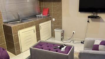 Singola Deluxe | Minibar, ferro/asse da stiro, Wi-Fi gratuito