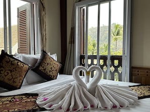 Luxury Quadruple Room | Living area | 21-inch flat-screen TV with premium channels, TV
