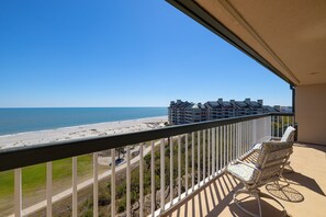 A balcony with a view of the beach and ocean, a chair, and a railing. - Oceanfront Villa in Wild Dunes w/2 Master Suites & Community Pool! Great Views! (Isle Of Palms)