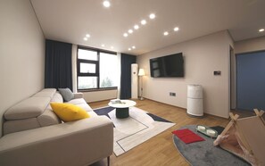 Suite Studio Familiale | Coin séjour | Chauffage par le sol