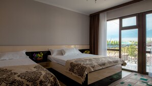 A hotel room with two beds, a large window with a view, and a balcony. - ololoFamily (Cholpon-Ata)