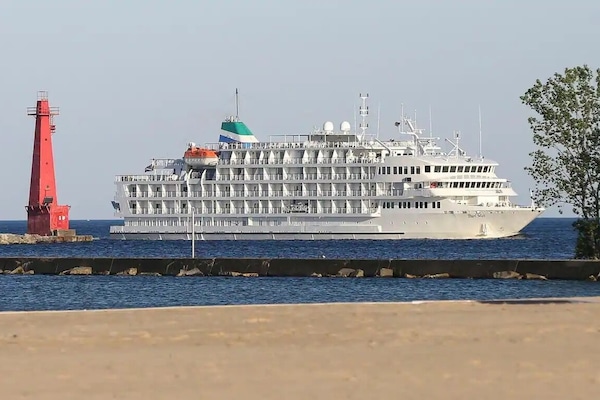 Watch the cruise ships come into Muskegon Lake
