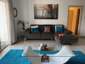 Apartamento, 1 cama Queen | Área de estar