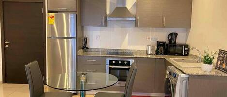 Apartment, 1 Queen Bed | Private kitchen | Fridge, microwave, oven, electric kettle