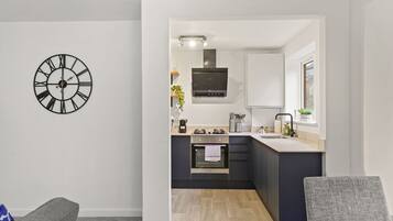 Family Apartment | Private kitchen | Fridge, microwave, oven, stovetop