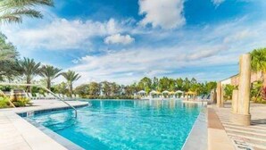A rectangular swimming pool with clear blue water, surrounded by a tiled deck. - Last Minute Disney Getaway! Private Pool & Themed Bedrooms. Book Now! #77303 (Davenport)