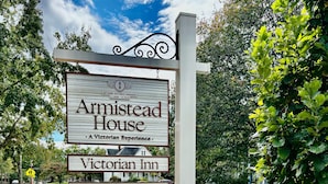 A sign for Armistead House, a Victorian Inn, with a reservation website listed. - Armistead House (Williamsburg)