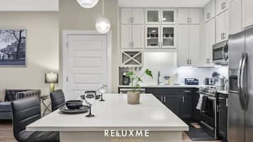 Coffee/tea maker, fridge, microwave, oven