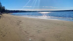 A beach with clear skies and calm water. - Cabin on the beach. (Miramichi)