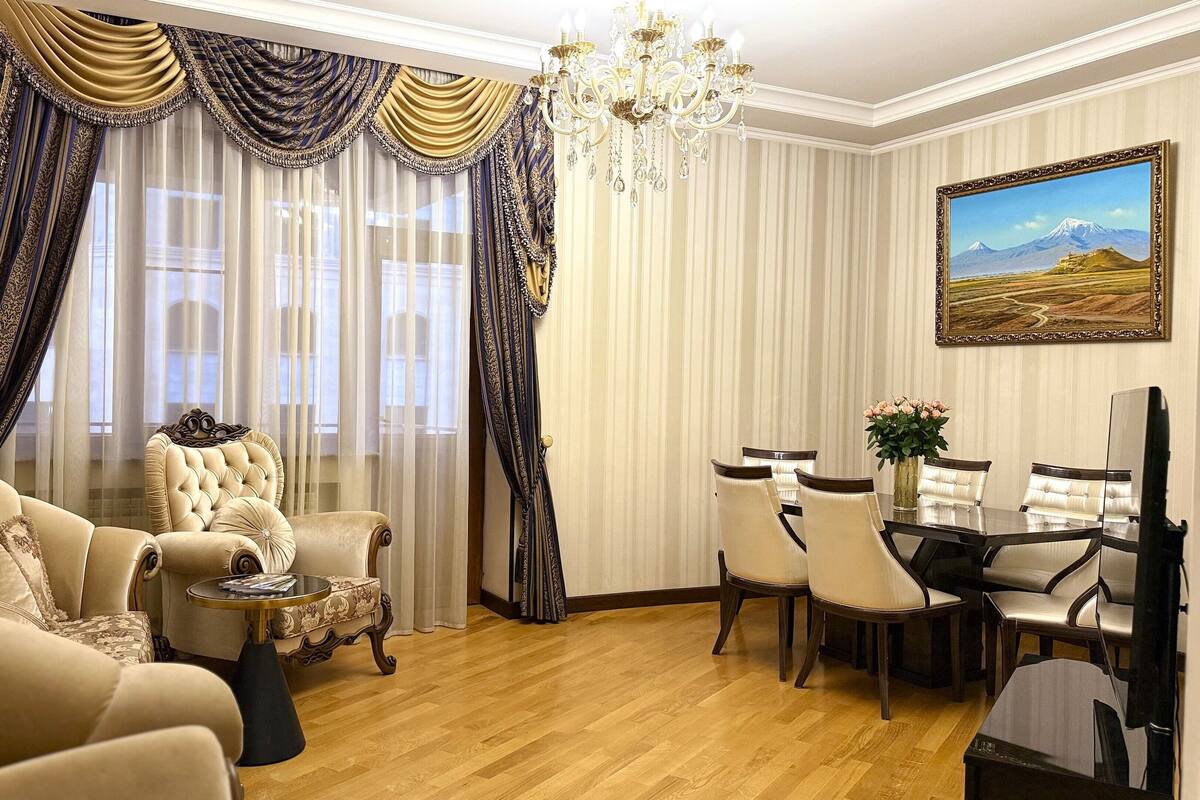 Elite Condo, 2 Bedrooms, Balcony, City View | Living area | 120-inch Smart TV with cable channels, TV