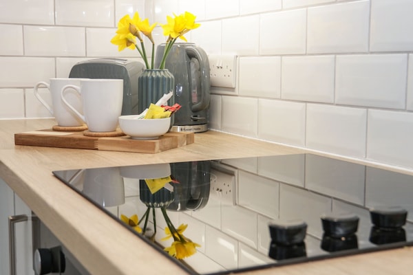 Fridge, electric kettle, toaster, cookware/dishes/utensils