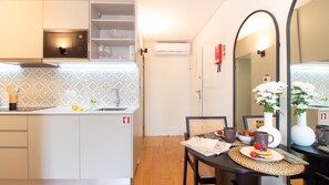 Fridge, microwave, stovetop, coffee/tea maker