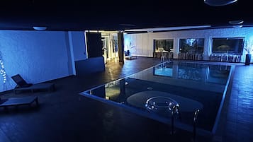 2 indoor pools, open 10:00 AM to 12:30 PM, pool umbrellas, pool loungers