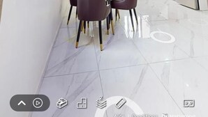 A modern kitchen with red cabinets, a stainless steel refrigerator, and a dining area with a table and chairs. - MARINA APPART HÔTEL  (Dakar)