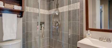 Shower, hair dryer, towels, soap