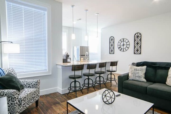 Stunning living room and kitchen. Stylish and comfortable!