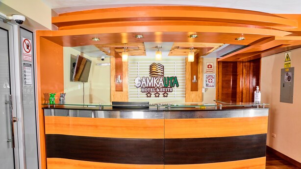A reception desk with a sign for Samkauta Hotel & Suite.