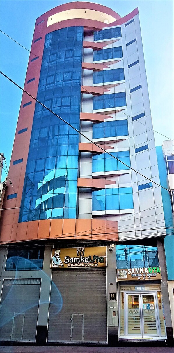 Experience the sleek, modern architecture of Samka Uta, offering accommodations and dining options in a vibrant urban setting.