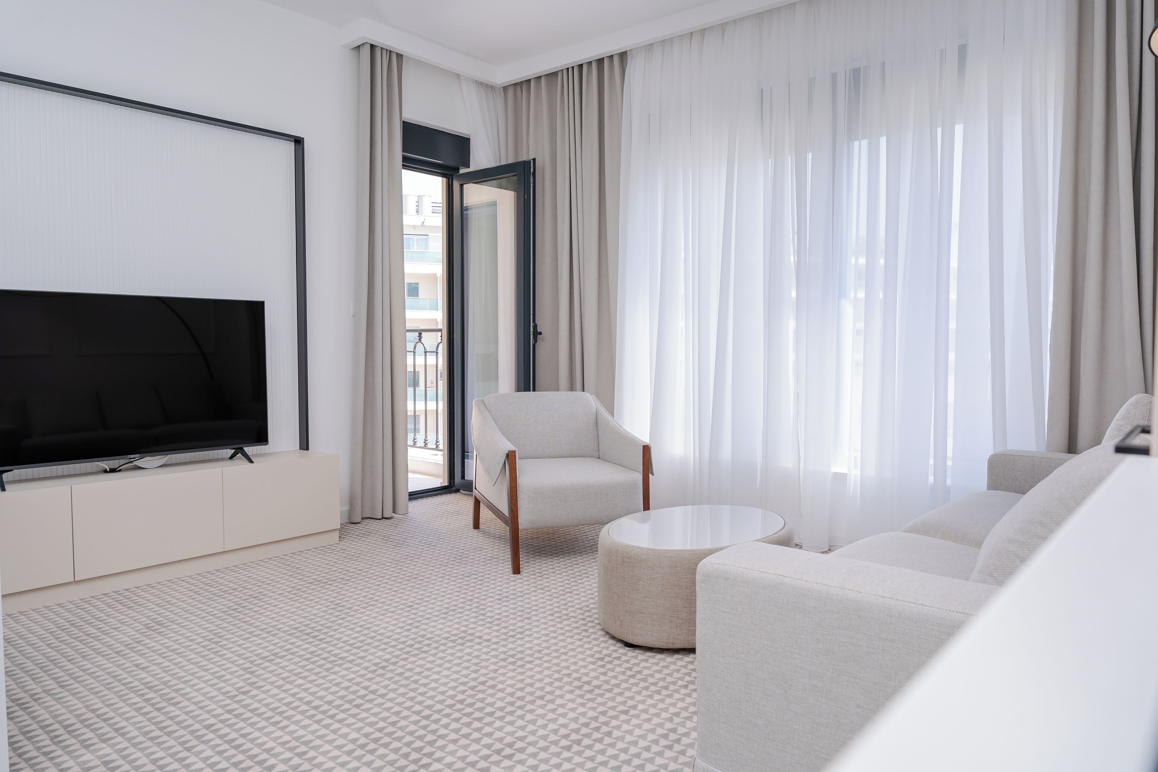 Junior Suite, 1 Bedroom | Living area | 55-inch Smart TV with cable channels, TV