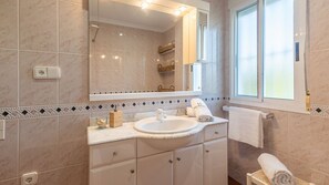 Bathtub, hair dryer, towels